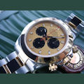 Rolex DAYTONA STEEL GOLD GOLD/BLACK DIAL